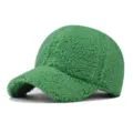 Detail shot of green sherpa baseball cap, thick fluffy fleece winter sun hat for outdoor wear. - Adjustable / Green