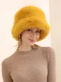 Close-up detail of fluffy yellow plush bucket hat, soft texture and stylish winter design. - Adjustable / Yellow