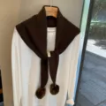 Dark brown knit hollow triangle scarf with pom poms, stylish wool winter shawl variant. - Coffee
