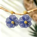 Blue hollow metal flower earrings, bohemian resort style, statement petal line drop earrings. - Klein Blue