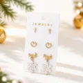 Gold-tone stud and drop earrings set with cross, heart and snowflake bow design for women. - Gold + White (25080609-6)