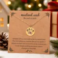 Collier empreinte de patte en acier inoxydable sur carte kraft avec citation inspirante. - Pendentif Empreinte de Patte / Or