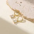 Boucles d'oreilles pendantes zircon taille émeraude or 14K, variante élégante et dorée. - Style (22091858)