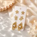 Gros plan détaillé sur l'ensemble de boucles d'oreilles étoile de mer perle plage. - Ensemble 11