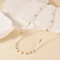 Elegant pearl and gold bead necklace featuring natural shell charms for stylish everyday wear. - White Pearl