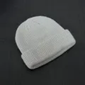 Detailed shot of a casual grey knit beanie, textured ribbed knit design and folded brim. - One Size / Light Gray