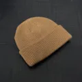 Detailed view of brown knit beanie showing fine ribbed texture and clean craftsmanship. - One Size / Khaki