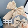 Beige organza bow hair clip with pearl rhinestone center and metal spring clip back variant. - Duckbill Hair Clips / Beige