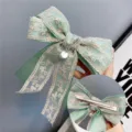 Mint green lace bow hair clip with pearl pendant and metal barrette variant for women - Duckbill Hair Clips / Fruit Green