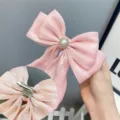 Pink bow hair clip with pearl rhinestone center, sweet lolita style variant for charming hair styling. - Brooch Clip / Pink