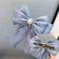 Blue satin hair bow clip with pearl rhinestone center, elegant long ribbon barrette for women. - Spring Clips / Gray