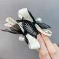 Black and white bow pearl hair claw clip detail, elegant hair accessory for women. - Beige Double Bow