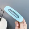 Light blue matte hollow hair clip for women, simple geometric design for daily styling and makeup. - Hollow-out Sky Blue