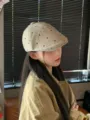 Detail shot of the Japanese retro heart embroidered newsboy cap worn by model indoors. - M (56-58cm) / Beige
