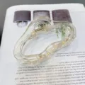 Clear acrylic cloud hair claw clip detail shot, featuring a stylish transparent design and spring. - Amber