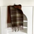 Detailed view of the thick warm plaid scarf with fringe, perfect for autumn and winter. - 48x230cm / Green Brown Plaid
