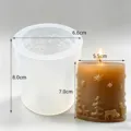 Silicone mold and Christmas candle detail view, showing embossed deer and snowflake patterns. - TC2022987 Christmas Mold