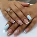 Detailed view of medium square press-on nails featuring classic French tips and glitter butterflies. - 24 Pcs/Set / CW939