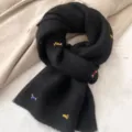 Chic black knitted winter scarf featuring cute dachshund embroidery, soft and warm neck warmer. - Black