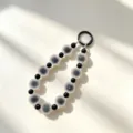 Minimalist black and white beaded phone charm and chic keychain strap accessory for daily style. - Black