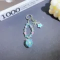 Detailed close-up of the cute crystal strawberry beaded keychain, featuring blue beads. - Light Blue