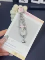 Detailed view of ins style star snake bone chain keychain phone charm and bag pendant. - Pink