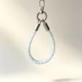 Colorful TPU telephone wire phone wrist strap detail showing flexible coiled design and metal clasp. - Blue Musical Note