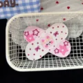 Cute anime pink bear hair clip detail view, embroidered band-aid shape sweet cute style accessory. - Pink