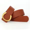 Stylish brown leather women belt featuring a matte gold horseshoe buckle for casual jeans wear. - 105cm / Camel