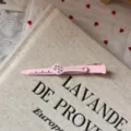 Close-up of cute pink rhinestone shovel hair clip detail, showcasing fine craftsmanship and sparkle. - Wrench Hair Clip / Pink