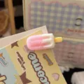 Close up detail shot of cute pink and white ice cream popsicle hair clip accessory on display card. - Pink Ice Cream Hair Clip