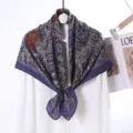 Detailed view of luxury velvet square scarf with paisley floral print and elegant dark blue tones. - Style 9