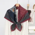 Detail view of the luxury velvet square scarf showing intricate chain print and texture details. - Style 13
