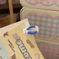 Close up detail of cute cartoon bear slipper hair clip with bow tie, perfect for daily cute hair styling. - Blue Slipper Hair Clip / Blue