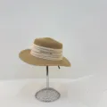 Detail view of a vintage beige straw hat with pleated ribbon and metallic bar decoration. - M (56-58cm) / Khaki