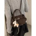 Korean style vintage crossbody shoulder bag for women with cute horse charm and brown PU leather. - With Pendant / Coffee