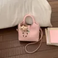 Pink leather bucket bag with cute bear pendant, stylish crossbody and shoulder bag. - With Charm / Pink