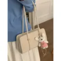 Minimalist beige shoulder bag for women with cute plush rabbit pendant stylish daily accessory. - With Pendant / White