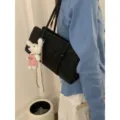 Black suede underarm shoulder bag for women, chic minimalist daily handbag with cute plush bear pendant. - With Pendant / Black