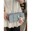 Light blue underarm bag with cute bunny pendant, chic PU leather bowling handbag for women. - With Pendant / Blue
