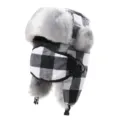 Detailed view of the black and white plaid bomber hat, featuring plush lining and face mask. - One Size / Black White Grid