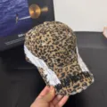 Leopard print baseball cap with embroidered angel wings and stylish streetwear text detail. - M / Leopard Yellow