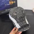 Leopard print baseball cap with white wings embroidery and distressed brim for streetwear style. - M / Leopard Print Black