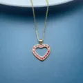 Elegant gold-plated heart pendant necklace featuring sparkling red stones for women chic style. - Red