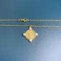 Gold beaded chain necklace with rhinestone cross pendant and four pearl accents for women. - Gold