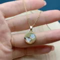 Gold plated chain necklace featuring a round mother-of-pearl butterfly and flower pendant. - Butterfly / Gold