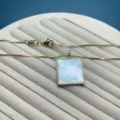 Minimalist gold box chain necklace featuring a square white mother-of-pearl pendant. - Square