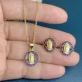 Vintage gold-plated Virgin Mary necklace and earrings jewelry set with blue rhinestone circle. - Blue