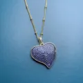 Detailed shot of gold tone chain necklace with large pave dark blue cubic zirconia heart pendant. - Style A 22mm / 22mm