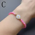 Chic pink beaded bracelet with white shell daisy flower and gold beads for women daily wear - Letter C